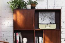 35 a mid-century modern dark-stained cabinet with hairpin legs is a catchy and cool idea for a modern living room