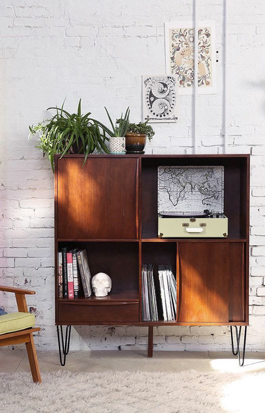 a mid-century modern dark-stained cabinet with hairpin legs is a catchy and cool idea for a modern living room