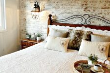 36 a cozy rustic space with a fake whitewashed brick wall and rich stained furniture that contrasts it