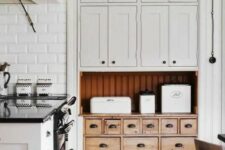 a cute kitchen pantry with a vintage cabinet