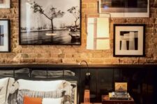 44 a vintage industrial bedroom with a brick wall and sleek black panels, vintage furniture and a gallery wall