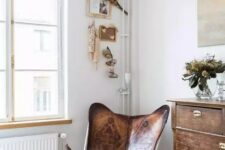 a beautiful leather printed butterfly chair paired up with a shabby chic dresser looks lovely and creates a cozy feel in the space