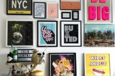 a colorful pop art gallery wall in various colors – posters for fun and with black and white frames is a bold idea