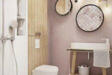 a contemporary bathroom with a mauve wall, wooden touches, round mirrors and a shower space
