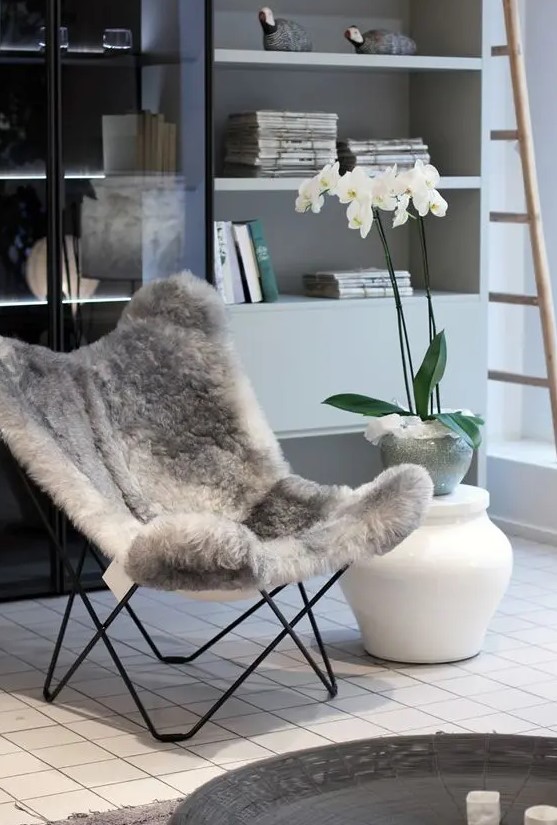 a faux fur butterfly chair is a gorgeous idea for a fall or winter space, it will make you feel cozy and comfy