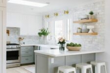 a grey and white kitchen with shaker cabinets, white countertops, a white marble tile backsplasgh and white metal stools