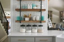 a grey farmhouse kitchen, a white tile backsplash and suspended shelves, white countertops for a rustic space