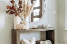 a lovely entryway decorated for fall