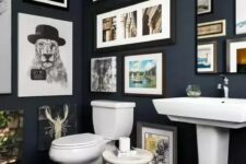 a stylish blue bathroom with lots of photos