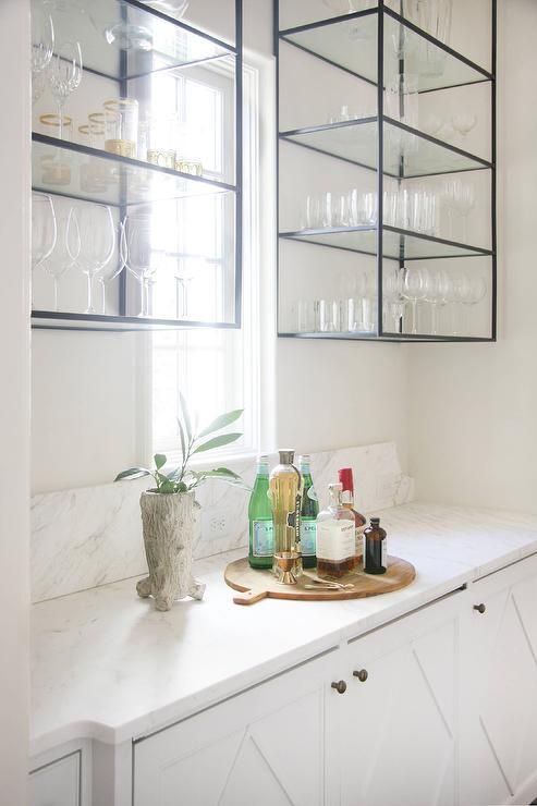 a stylish white kitchen with inlay cabinets, black metal and glass shelves suspended is a catchy and stylish idea