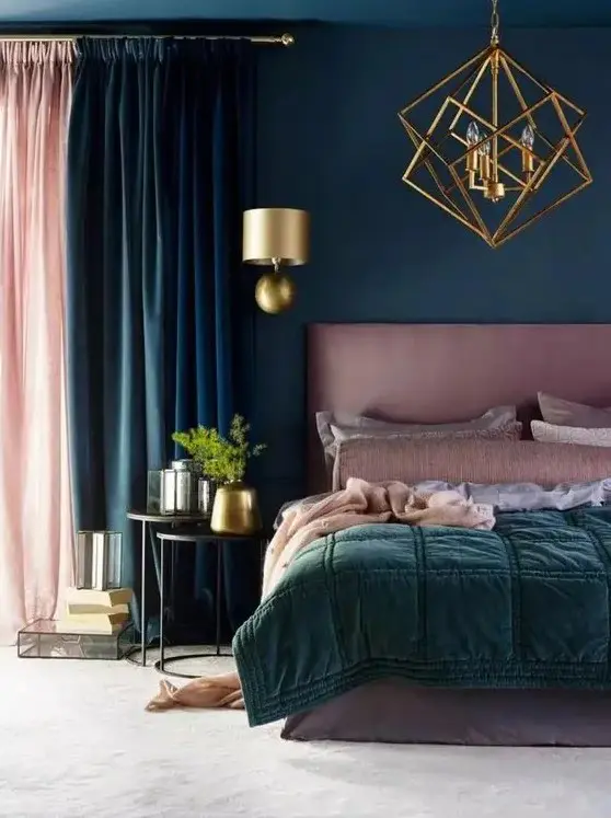 a teal bedroom with a mauve bed, mauve and green bedding, a pink and teal curtain, gold touches for elegance