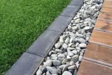 04 a pebble and dark brick border will fit a modern garden and will make it look edgy and stylish