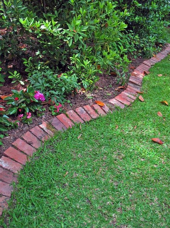 red brick edging is a stylish idea that fits most of outdoor landscaping styles and a touch of color