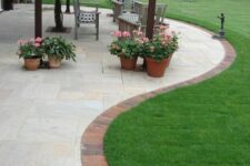 12 a green lawn, a stone patio and brick edging are a lovely combo for a modern garden, they look chic together