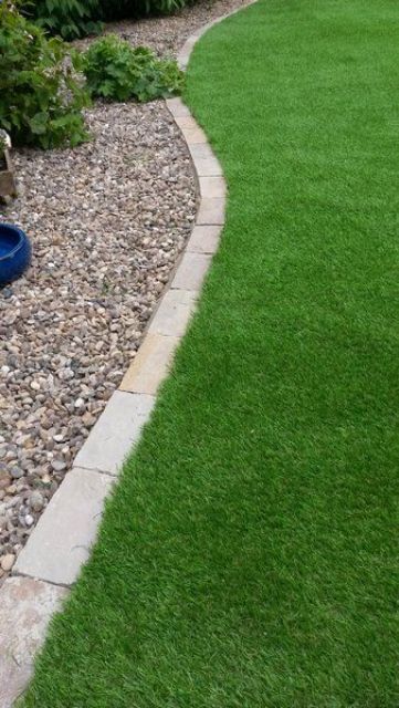 a green lawn, brick edging and a gravel space look very cool and elegant together, this is a classic combo