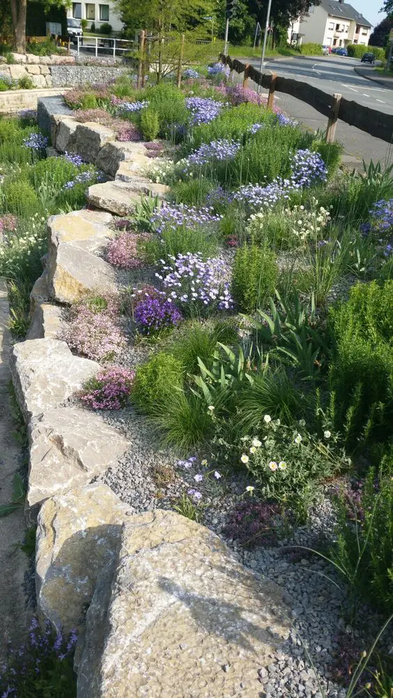 large rock garden bed edging is a stylish idea that looks all-natural and relaxed, this is a very durable idea