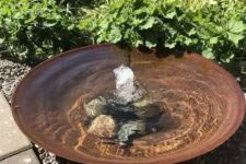 16 a super simple modern bowl fountain with rocks on the bottom is a great water feature for a modern garden, and your pets can refresh themselves in it