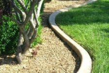 19 curved concrete garden bed edging is a chic minimalist idea that will match any plants