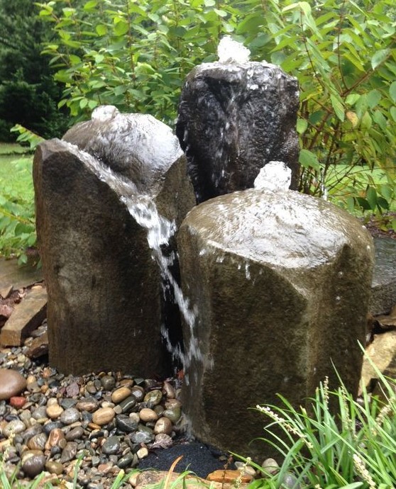 a basalt fountain is a cool idea for a desert garden, it looks very natural and refreshing