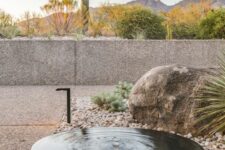 23 a large metal bowl placed on large rocks is a cool outdoor water feature and decor idea to rock, it will be a nice idea for a desert garden