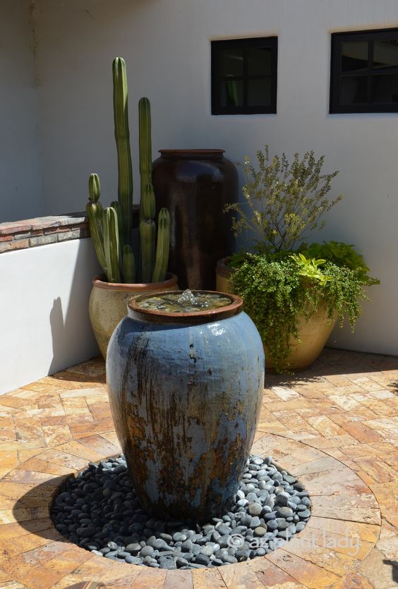 a large vase fountain placed in your desert garden or patio is a cool piece of attraction to rock it, it will bring more peace and relaxation