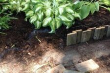 30 simple reclaimed wood garden edging is a cool idea for a rustic space, you can upcycle some old piece easily