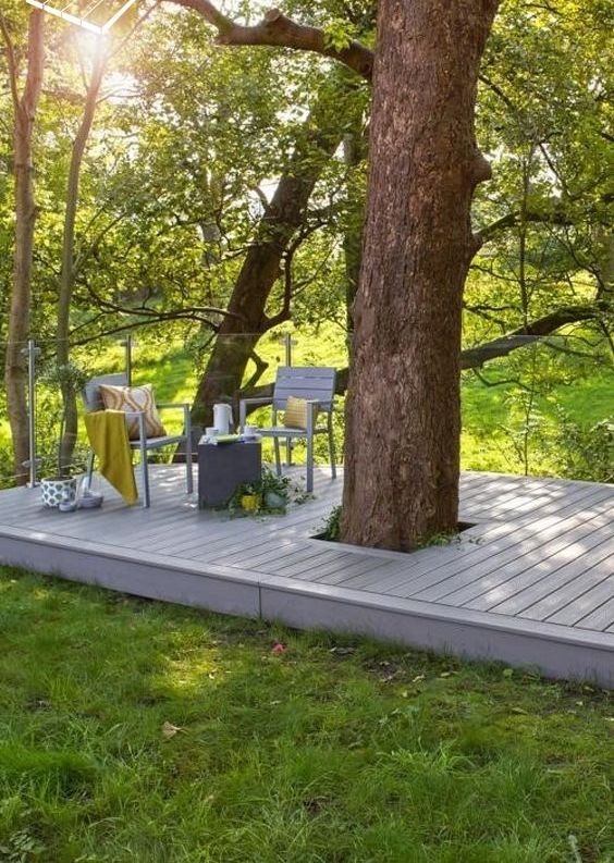 a deck built around the tree allows you to leave the tree on its place and still use the space around it to advantage