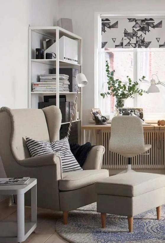 a Nordic space with a shelving unit, a windowsill desk, a neutral chair, a grey Strandmon chair and a footrest, a side table and printed textles