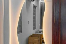 a beautiful irregularly shaped mirror with lights is a cool idea not only for an entryway but also for many other spaces