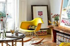 a bright mid-century modern space with a living edge bench, a yellow Eames rocker, an Easten style coffee table and some artwork