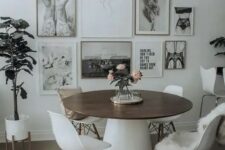 a cozy dining space with a b&w gallery wall