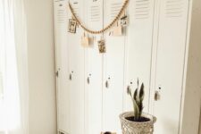 a cool set of white lockers used for storage and displaying things, some potted plants to make the space cozier