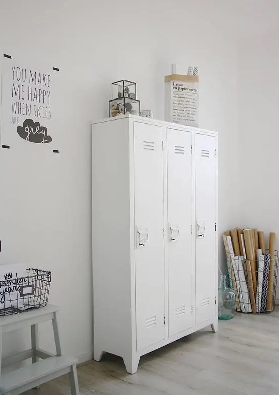 a craft room completed with white lockers that are used for storing all the stuff you want and need