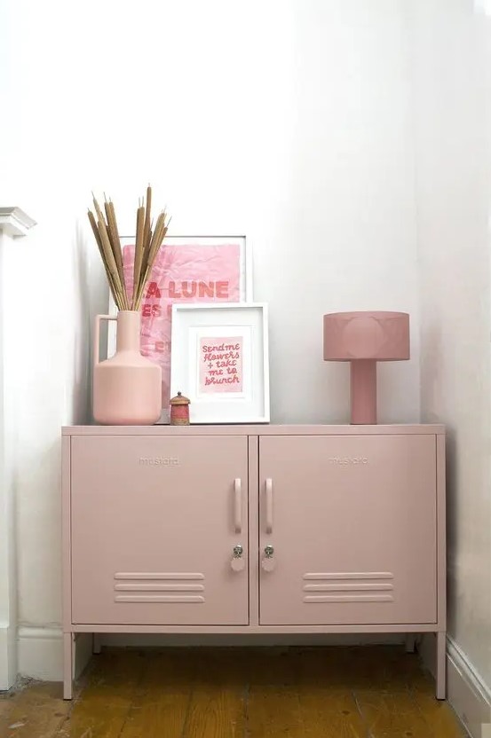 a dusty pink locker unit with various decor can easily match many spaces, and its delicate will makes it look softer