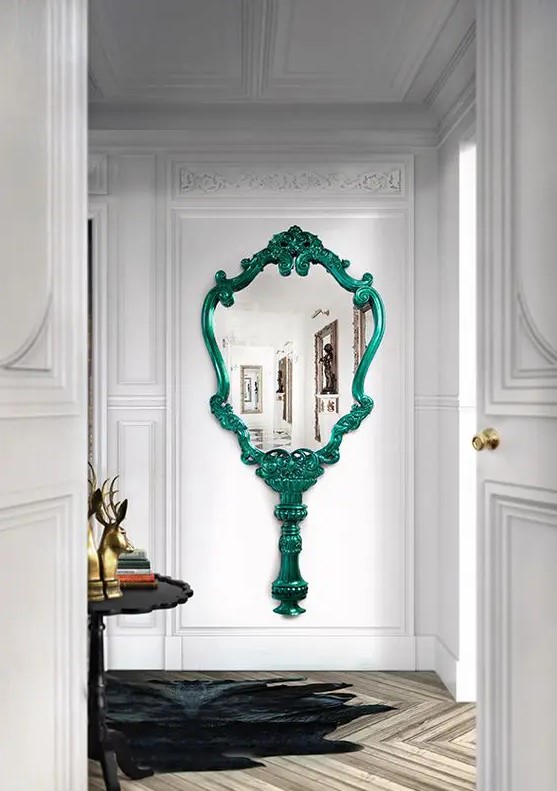 a fantastic mirror inspired by vintage hand mirrors, with a green frame and handle is a lovely idea for a refined entryway or a chic closet