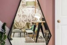 a geometric drop shaped mirror with a black frame is a stylish and catchy solution for a modern space, it will bring a unique geo shape to the space