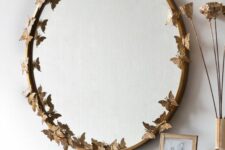 a lovely round mirror with creative butterflies decor