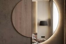a semi circle mirror with a plywood half and lights built-in is a great art-like solution for a bedroom
