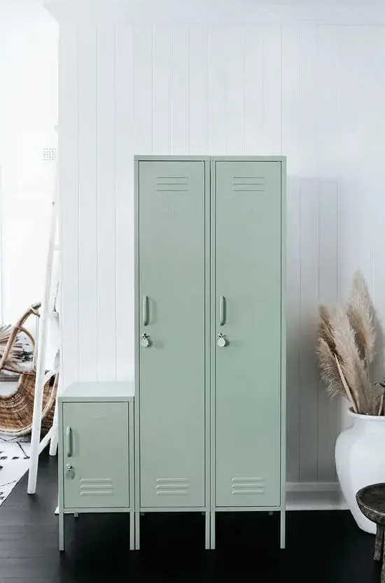 a set of light green skinny lockers is a lovely idea for a Scandinavian space, it's a delicate touch of color