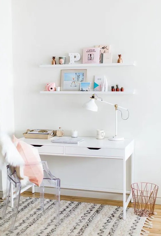 a small serene working space with an IKEA desk, a ghost chair, a couple of ledges and a printed rug is a cool nook