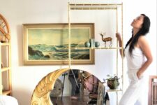 an eye-catchy round mirror with a half moon as a frame is a cool and unusual solution for any boho space