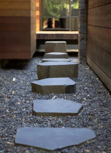 gravel and stones of various sizes, height and shapes add interest to the neutral and minimalist garden