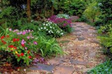 pebbles and rough stones of various shapes and looks create a very natural and relaxed path