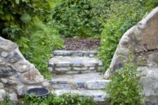 stone steps with pebble pathways and greenery growing here and there make the space look cooler