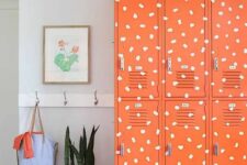 super bold orange lockers featuring a fun print will add a touch of whimsy to the space and will bring color to it, perfect for a kids’ room