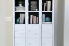 white skinny lockers turned into a stylish bookcase, with partly opened compartments and partly closed ones