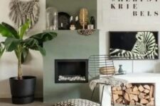 05 a cool boho nook with an olive green fireplace, a bench with firewood storage, some art and a potted plant