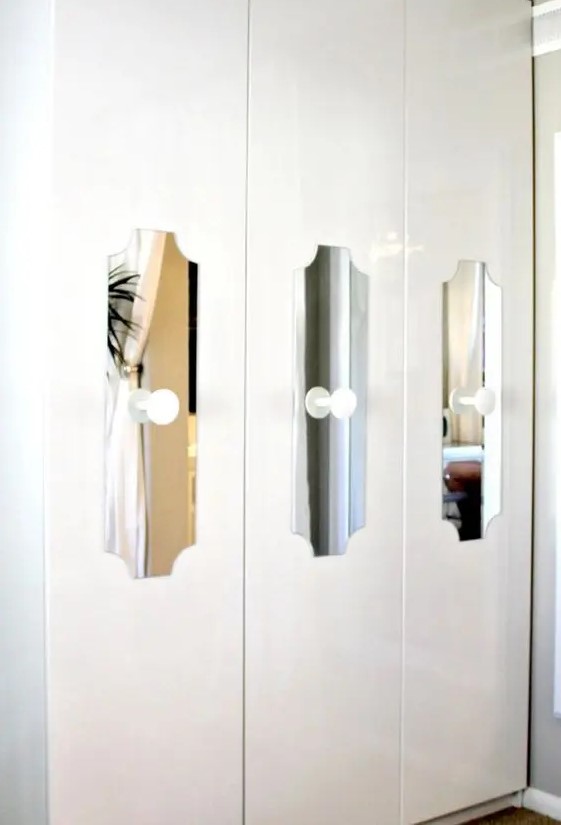 cutout mirror touches with white knobs add interest to a Pax wardrobe and make it stand out