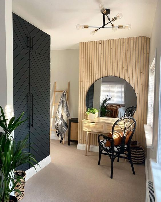 a farmhouse netryway with a wood slat wall with a round mirror, a console and a chair, a built-in IKEA Pax wardrobe
