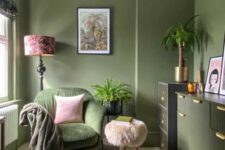37 an olive green space with matching furniture, some light pink accents, potted plants and bold artwork is amazing